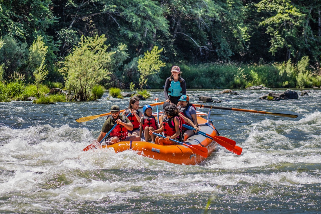 Family with a female Orange Torpedo Trips in lower Galice rapid on the Rogue River