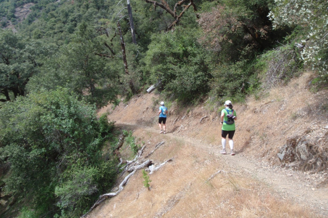 Two people running the Rogue River Trail