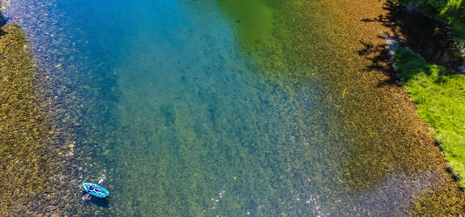 North Umpqua river kayaker in clear water