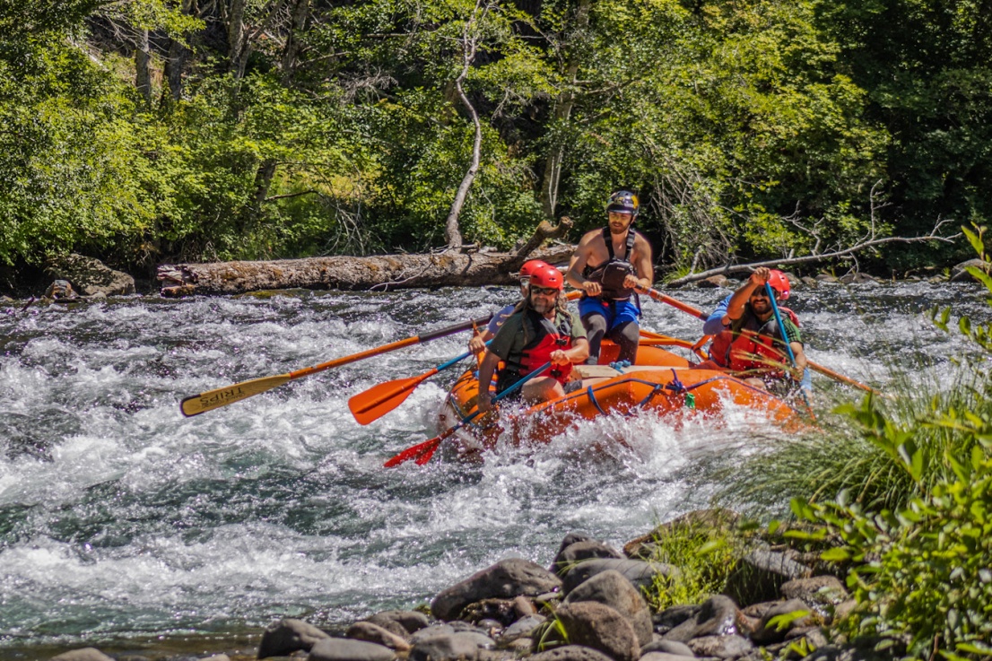 Orange Torpedo Trips rafting in big waves on the North Umpqua River