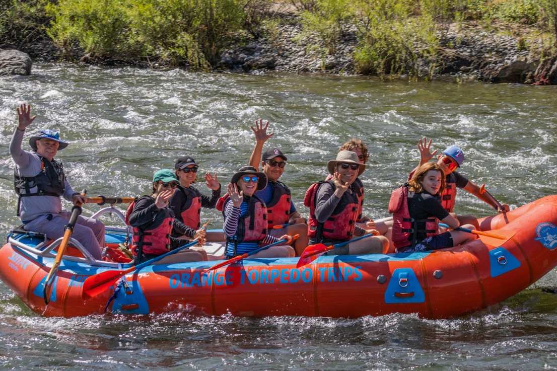 Youth inflatable kayaking some whitewater on the Rogue River