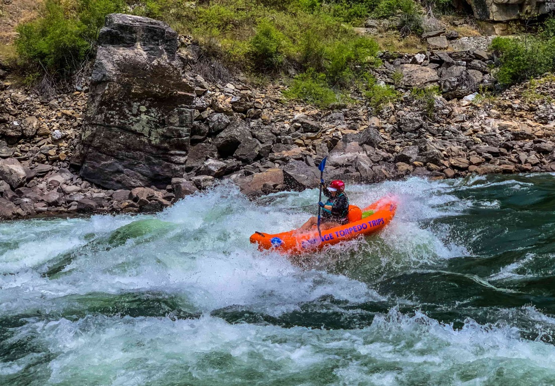 Kayaker in alder creek rapid on the main salmon