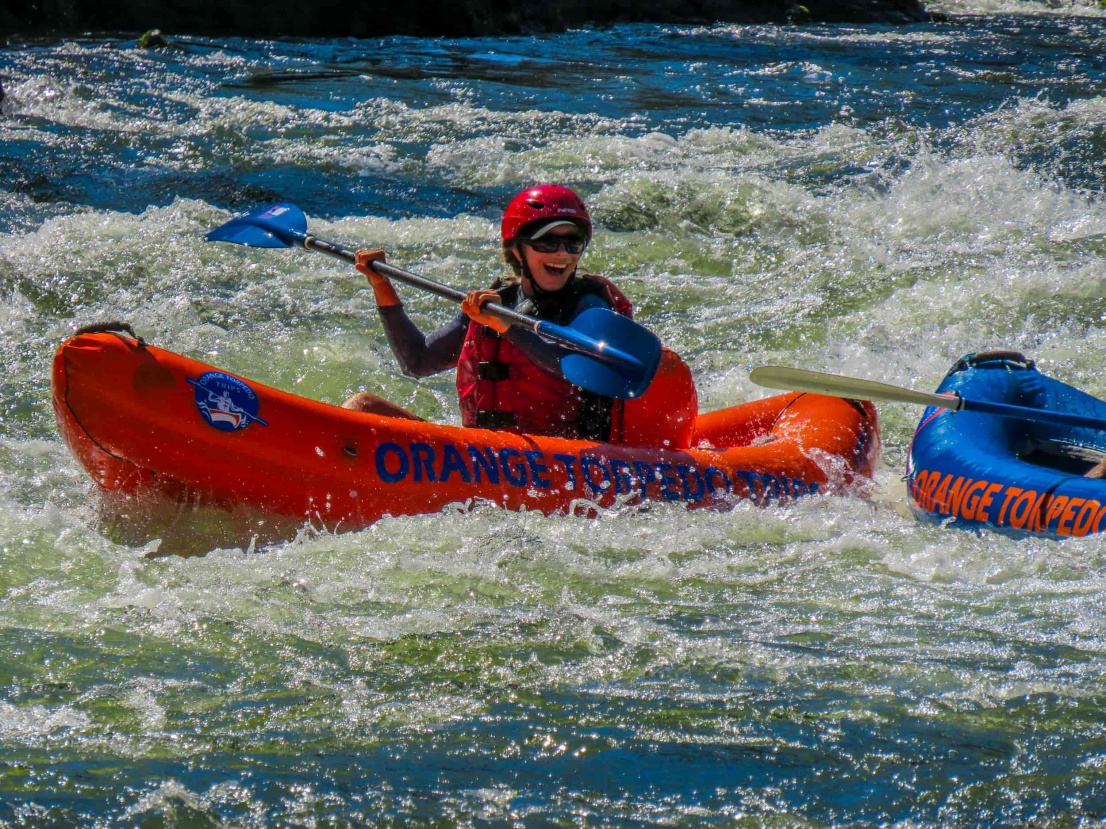 Woman inflatable kayaking on the Rogue River