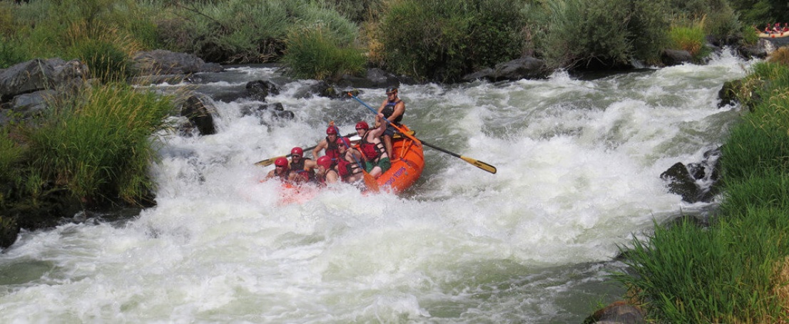 Group rafting with a guide at Nugget Falls on the Rogue River