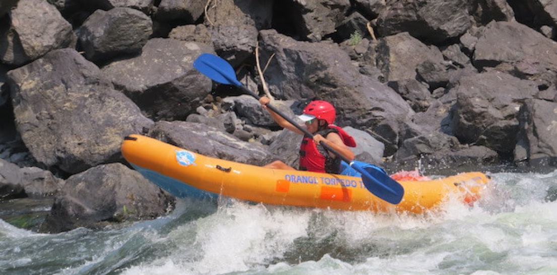 Mom learning to inflatable kayak near McCall Idaho