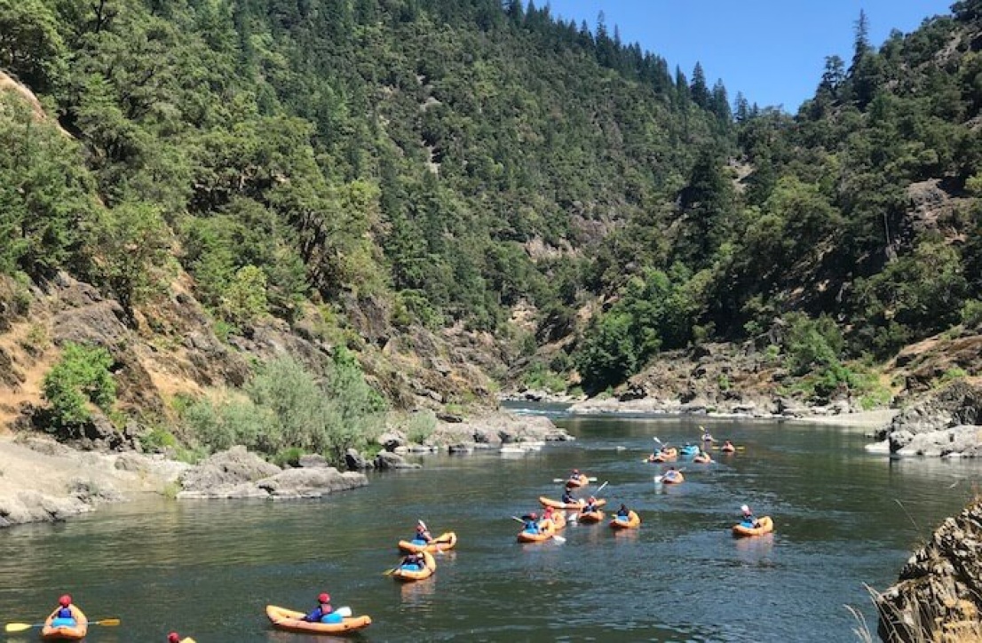 Group of inflatable kayaks in a pool on the Rogue River
