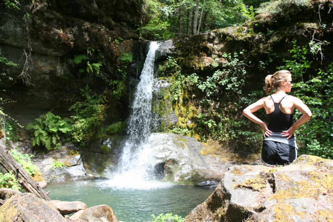 Lady near a waterfall on the Rogue River Trail