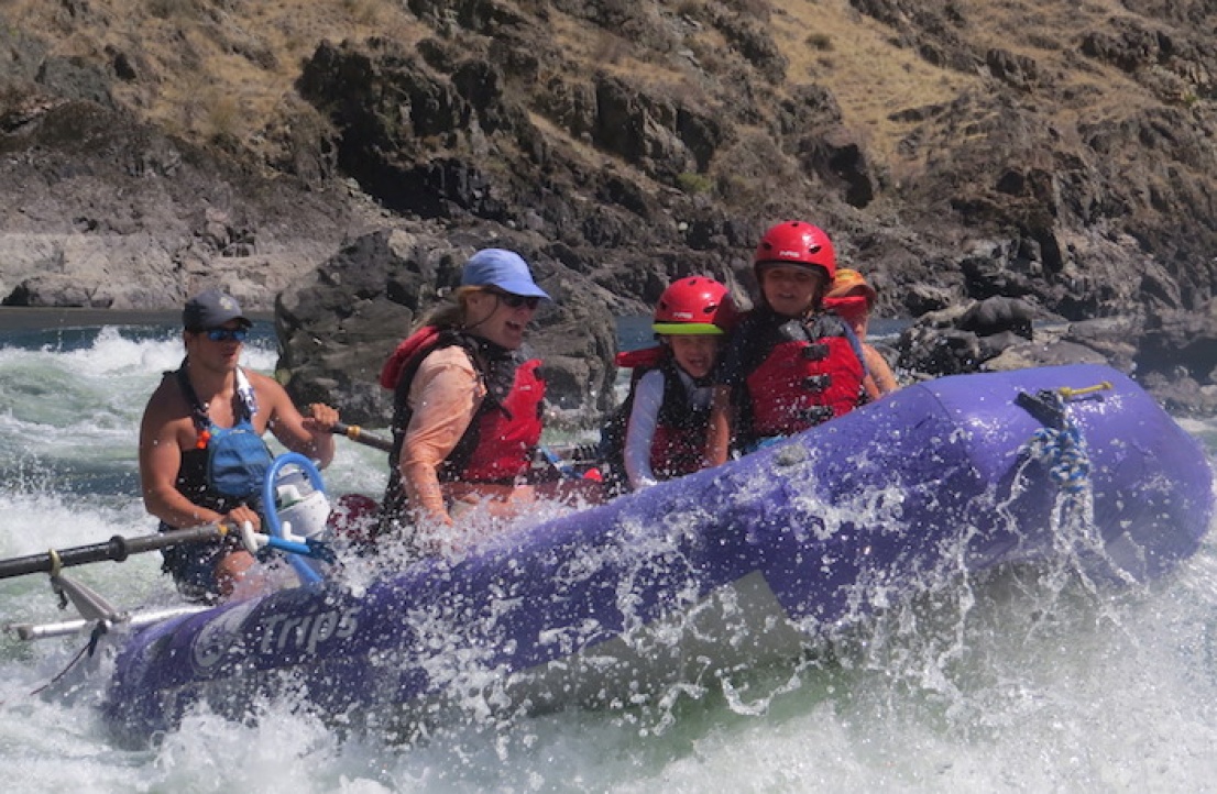 Family having fun rafting on the salmon river