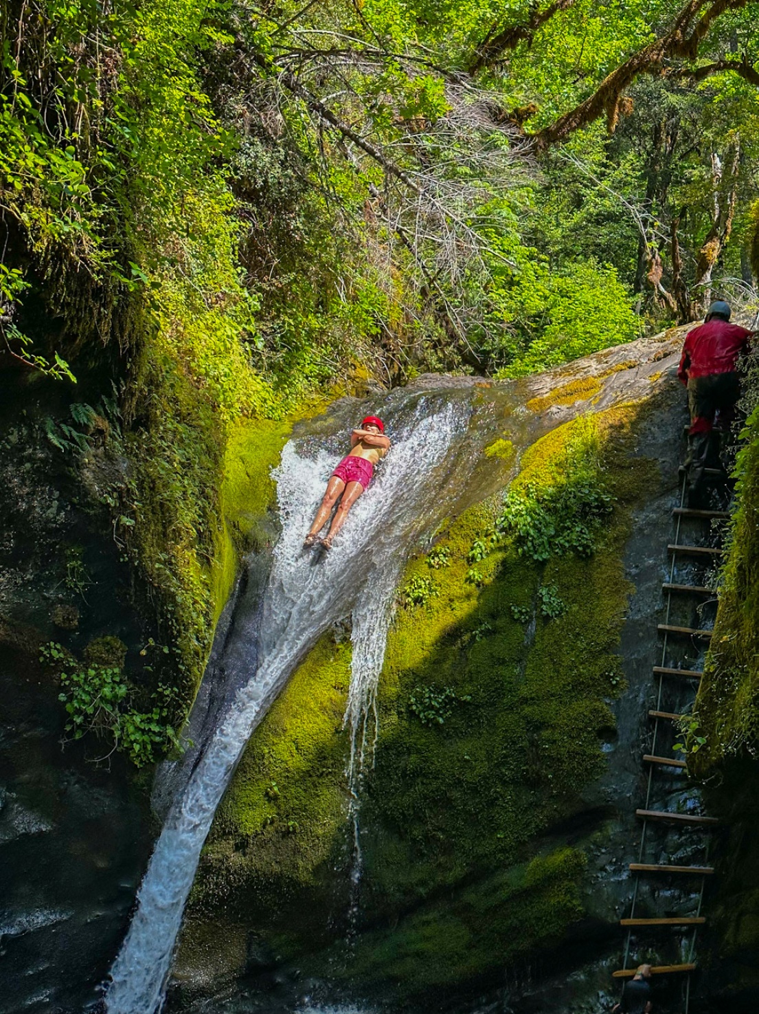 Riding the Tate Creek slide on the Rogue River