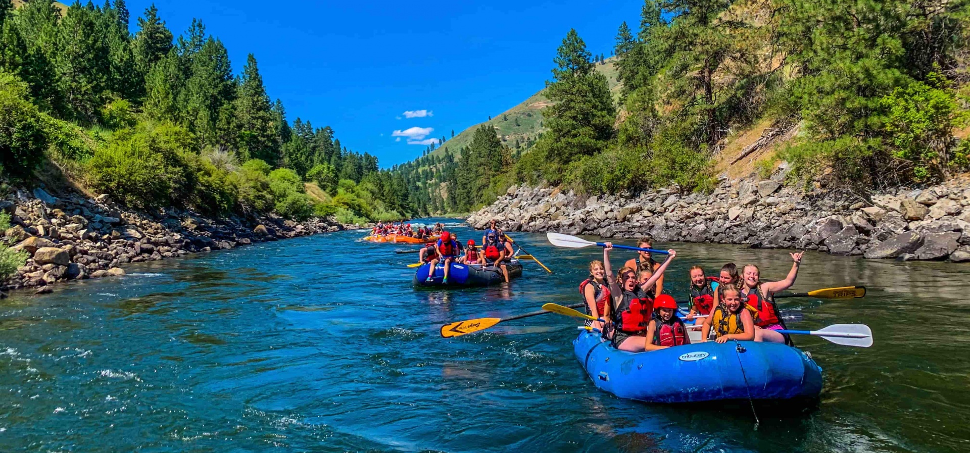Group of kids rafting on the Payette River with Orange Torpedo Trips