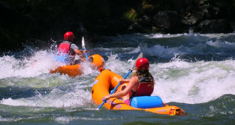 Two kayakers on the Rogue River at Grave Creek